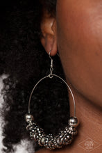 Load image into Gallery viewer, A stunning array of studded silver accents, oversized silver beads, and hematite rhinestone encrusted black beads are threaded along a dainty silver wire hoop, resulting in a dazzling pop of color. Earring attaches to a standard fishhook fitting.  Sold as one pair of earrings.
