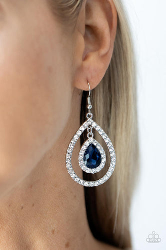 A brilliant blue teardrop gem, encased in a sparkling white rhinestone frame, creates a striking pendant as it dangles inside an airy teardrop frame encrusted with white rhinestones and culminates into a mesmerizing lure. Earring attaches to a standard fishhook fitting.  Sold as one pair of earrings.