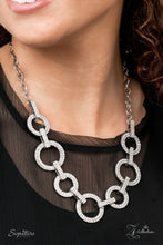 Load image into Gallery viewer, Zi Collection Necklace 2021 - The Missy - Paparazzi Elegantly enhanced with white rhinestone encrusted links, an effervescent array of white rhinestone encrusted silver hoops glamorously alternate below the collar for an unapologetically audacious sparkle. Features an adjustable clasp closure.   Sold as one individual necklace. Includes one pair of matching earrings.

