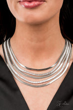 Load image into Gallery viewer, Zi Collection Necklace 2021 - Persuasive - Paparazzi Alternating rows of flat silver snake chain and glassy strands of edgy emerald cut rhinestones sleekly layer below the collar. The deceptively simple metallic silver and white rhinestone palette is unapologetically mesmerizing, making this smooth statement piece an instant classic. Features an adjustable clasp closure.  Sold as one individual necklace. Includes one pair of matching earrings.
