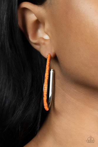 A dainty collection of orange seed beads embellish the beveled spine of a silver hook shaped hoop, creating a trendy pop of color. Hoop measures approximately 1 1/2