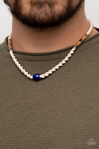 Featuring glazed, matte, and polished finishes, an earthy collection of brown and blue beads are knotted in place along a braided twine-like cord below the collar, creating an authentically urban centerpiece. Features a button loop closure.  Sold as one individual necklace.
