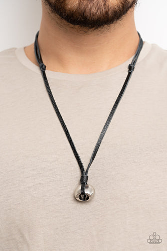 A chunky silver bead is knotted in place at the bottom of black leather laces, resulting in an urban pendant. Features an adjustable sliding knot closure.  Sold as one individual necklace.