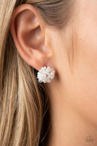 The front of a dainty silver frame is embellished in pearly white seed beads and white crystal-like accents, creating a bubbly pop of color. Earring attaches to a standard post fitting.  Sold as one pair of post earrings.