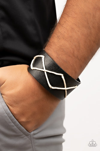 Spun white cording crisscrosses across the front of a shiny black leather band, resulting in a rustic centerpiece around the wrist. Features an adjustable snap closure.  Sold as one individual bracelet.