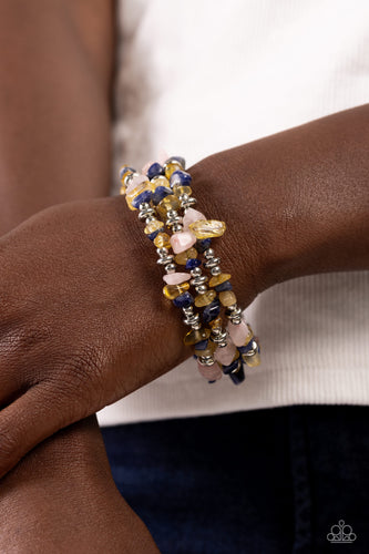 Featuring a chiseled finish, a mismatched collection of yellow, lapis, and rose quartz stones and shiny silver beads are threaded along a coiled wire, creating an earthy infinity wrap-style bracelet. As the stone elements in this piece are natural, some color variation is normal.  Sold as one individual bracelet