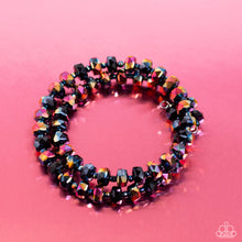 Load image into Gallery viewer, Featuring a UV shimmer, a glistening collection of faceted metallic black beads alternate with dainty oil spill studs along a coiled wire, creating a jaw-dropping infinity wrap bracelet around the wrist. Due to its prismatic palette, color may vary.  Sold as one individual bracelet.
