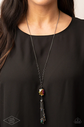 Featuring an oil spill finish, a faceted oil spill gem attaches to the bottom of a lengthened gunmetal chain featuring sections of airy chain links. Infused with dainty gunmetal and matching oil spill beads, shimmery gunmetal chains stream from the bottom of a hematite dotted cap, creating an edgy tassel. Features an adjustable clasp closure.  Sold as one individual necklace. Includes one pair of matching earrings.