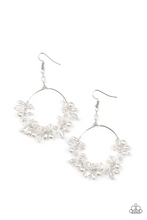 Load image into Gallery viewer, A timeless collection of iridescent crystal-like accents, dainty white pearls, and white floral frames delicately cluster along the bottom of a silver hoop, creating a glamorous glow. The earring attaches to a standard fishhook fitting.  Sold as one pair of earrings.
