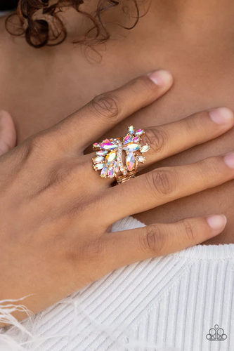 An explosion of iridescent marquise cut rhinestones flare out from a wavy band of dainty white rhinestones, creating a glamorously golden centerpiece atop the finger. Features an adjustable clasp closure.  Sold as one individual ring. 