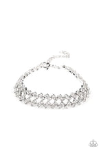 Load image into Gallery viewer, Set in pronged silver settings, pairs of icy white rhinestones haphazardly stack around the wrist in sizzling rows of shimmer. Features an adjustable clasp closure.  Sold as one individual bracelet.
