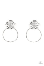 Load image into Gallery viewer, Featuring lifelike textures, a shimmery silver buttercup blooms atop an oversized silver hoop for a whimsical allure. The earring attaches to a standard post-fitting.  Sold as one pair of post earrings.
