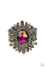 Load image into Gallery viewer, A large oil spill rhinestone sparkles inside a ring of dainty hematite rhinestones. Emerald-cut oil spill and hematite rhinestones fan out from the dazzling center, exploding into a stellar centerpiece atop the finger. Features a stretchy band for a flexible fit. Due to its prismatic palette, color may vary.  Sold as one individual ring.
