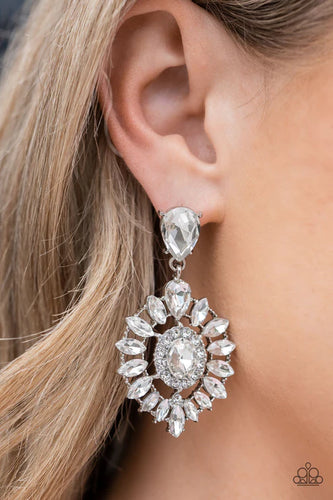 Bordered in dainty white rhinestones, an oval white gem is pressed into the center of an explosion of white marquise cut rhinestones. The icy frame swings from the bottom of a solitaire teardrop rhinestone, adding flirtatious movement to the jaw-dropping display. Earring attaches to a standard post fitting.  Sold as one pair of post earrings.