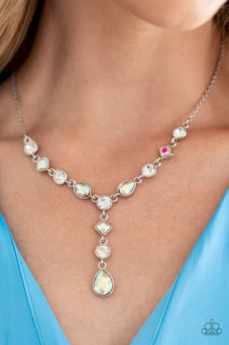 Brilliant white round-cut rhinestones alternate between diamonds and teardrops with an iridescent finish, creating an elegant lariat fit for royalty. Due to its prismatic palette, color may vary. Features an adjustable clasp closure.  Sold as one individual necklace. Includes one pair of matching earrin