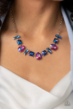 Load image into Gallery viewer, Featuring glassy, iridescent, and oil spill finishes, a mismatched collection of emerald cut blue, square multicolored, and teardrop pink gems delicately connects below the collar for a stellar statement. Features an adjustable clasp closure.  Sold as one individual necklace. Includes one pair of matching earrings.
