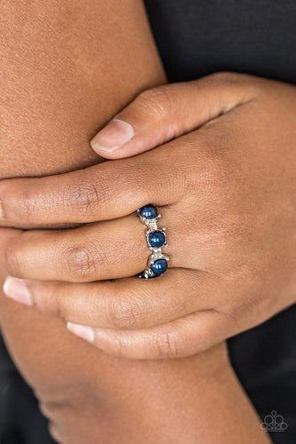 Pearly blue beads are encrusted along a shimmery silver band for a refined look. Features a dainty stretchy band for a flexible fit.  Sold as one individual ring.