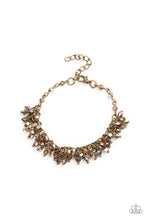 Load image into Gallery viewer, Dainty brassy tone-on-tone iridescent beads swing from a classic brass chain, creating a clustered fringe around the wrist. Features an adjustable clasp closure.  Sold as one individual bracelet.
