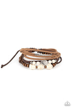 Load image into Gallery viewer, Featuring natural white stone and silver accents, a collection of leather strands and wooden beads encircle the wrist in a subtle Southwestern fashion. Features an adjustable sliding knot closure.  Sold as one individual bracelet.
