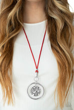 Load image into Gallery viewer, An oversized hammered disc swings from the top of a bold silver hoop that attaches to mismatched silver fittings at the bottom of a lengthened red cord, creating a dramatic pendant. Features an adjustable clasp closure.  Sold as one individual necklace. Includes one pair of matching earrings.
