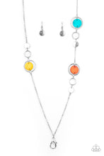 Load image into Gallery viewer, A shimmery collection of dainty silver discs, shiny silver rings, and blue, yellow, and orange shell-like frames delicately link across the chest, creating a summery display. A lobster clasp hangs from the bottom of the design to allow a name badge or other item to be attached. Features an adjustable clasp closure.

