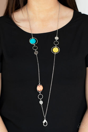 A shimmery collection of dainty silver discs, shiny silver rings, and blue, yellow, and orange shell-like frames delicately link across the chest, creating a summery display. A lobster clasp hangs from the bottom of the design to allow a name badge or other item to be attached. Features an adjustable clasp closure.