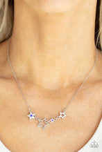 Load image into Gallery viewer, A mismatched collection of airy silver stars and blue rhinestone dotted star frames delicately link below the collar, creating a stellar patriotic inspired pendant. Features an adjustable clasp closure.  Sold as one individual necklace. Includes one pair of matching earrings.
