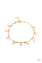 Load image into Gallery viewer, A collection of dainty gold stars and curved gold bars delicately connect around the wrist, creating a stellar fringe. Features an adjustable clasp closure.
