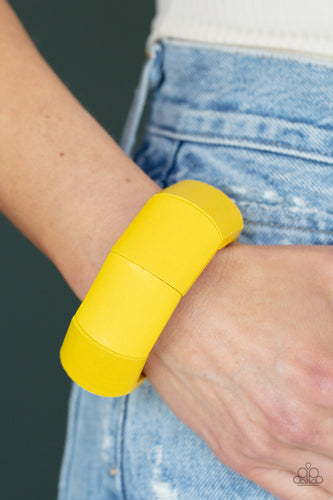 Painted in a sunny yellow finish, chunky geometric wooden beads are threaded along stretchy bands around the wrist for a colorful tropical inspired look.  Sold as one individual bracelet.