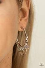 Load image into Gallery viewer, A shiny collection of silver star charms trickles from the bottom of a classic silver hoop, creating a stellar fringe. Earring attaches to a standard post fitting. Hoop measures approximately 1 1/4&quot; in diameter.  Sold as one pair of hoop earrings.
