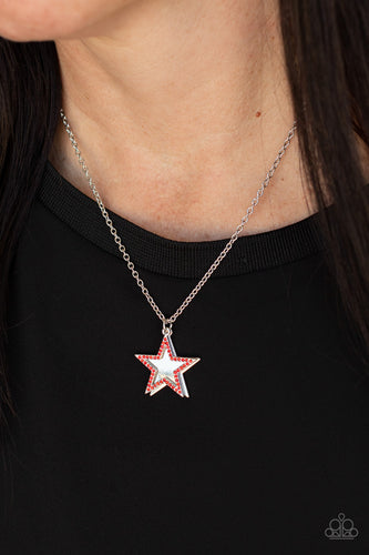 A red rhinestone encrusted silver star delicately overlaps with a shiny silver star below the collar, creating a sparkly patriotic pendant. Features an adjustable clasp closure.  Sold as one individual necklace. Includes one pair of matching earrings.