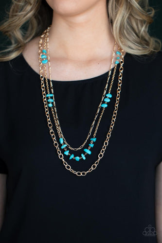 Infused with sections of refreshing turquoise stones, a trio of mismatched gold chains layer down the chest for a dash of earthy refinement. Features an adjustable clasp closure.  Sold as one individual necklace. Includes one pair of matching earrings.