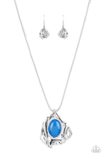 Load image into Gallery viewer, A glassy blue oval bead is pressed into the center of an abstract silver frame below the collar, creating a colorful artisan inspired pendant at the bottom of a rounded silver snake chain. Features an adjustable clasp closure.  Sold as one individual necklace. Includes one pair of matching earrings.
