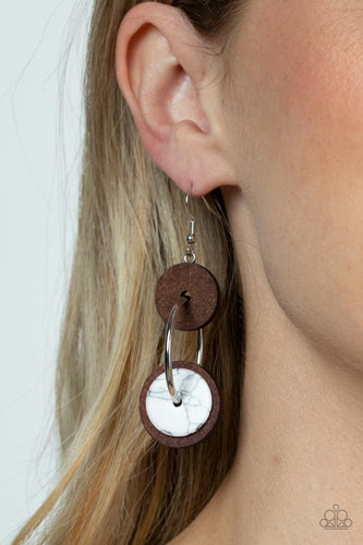 An earthy collection of brown wood and white stone discs are threaded along a silver hoop, linking into a trendy lure for an artisan inspired fashion. Earring attaches to a standard fishhook fitting.  Sold as one pair of earrings.