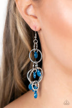 Load image into Gallery viewer, Opaque Mykonos Blue teardrops sporadically cascade from an assortment of mismatched silver links, resulting in a whimsically tasseled chandelier. Earring attaches to a standard fishhook fitting.
