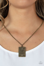 Load image into Gallery viewer, Bordered in leafy patterns and dainty white rhinestones, the center of a rectangular brass frame is stamped in the phrase, &quot;Trust in the Lord,&quot; for an inspiring finish. Features an adjustable clasp closure.  Sold as one individual necklace. Includes one pair of matching earrings.
