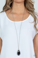 Load image into Gallery viewer, Capped in a white rhinestone encrusted fitting, glittery silver ribbons of white rhinestones delicately wrap around the top of a dramatically oversized smoky teardrop gem. The smoldering pendant swings from the bottom of a lengthened silver chain, creating a glamorous statement piece. Features an adjustable clasp closure.  Sold as one individual necklace. Includes one pair of matching earrings.
