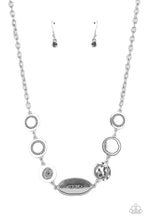 Load image into Gallery viewer, Sporadically dotted in dainty hematite rhinestones and metallic rope-like texture, an asymmetrical assortment of shiny silver frames delicately link below the collar for a one-of-a-kind shimmer. Features an adjustable clasp closure.  Sold as one individual necklace. Includes one pair of matching earrings.
