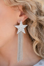 Load image into Gallery viewer, A curtain of silver chains streams out from the bottom of an oversized silver star encrusted in blinding white rhinestones, resulting in a stellar tassel. Earring attaches to a standard post fitting.  Sold as one pair of post earrings.
