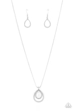 Load image into Gallery viewer, Infused with shimmering sparkle, a faceted white teardrop gem connects to the top of a textured silver teardrop frame, resulting in an enchanting pendant below the collar. Features an adjustable clasp closure.  Sold as one individual necklace. Includes one pair of matching earrings.
