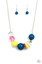 Load image into Gallery viewer, Infused with a single silver bead, an oversized collection of glassy and polished acrylic beads and rings are threaded along an invisible wire below the collar for a flamboyant fashion. Features an adjustable clasp closure.  Sold as one individual necklace. Includes one pair of matching earrings.

