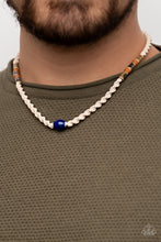 Load image into Gallery viewer, Featuring glazed, matte, and polished finishes, an earthy collection of brown and blue beads are knotted in place along a braided twine-like cord below the collar, creating an authentically urban centerpiece. Features a button loop closure.  Sold as one individual necklace.
