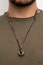 Load image into Gallery viewer, A chunky silver bead is knotted in place at the bottom of brown leather laces, resulting in an urban pendant. Features an adjustable sliding knot closure.  Sold as one individual necklace.
