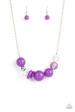 Load image into Gallery viewer, Infused with a single silver bead, an oversized collection of glassy and polished translucent and purple acrylic beads and rings are threaded along an invisible wire below the collar for a flamboyant fashion. Features an adjustable clasp closure.  Sold as one individual necklace. Includes one pair of matching earrings.
