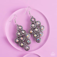 Load image into Gallery viewer, Dotted with iridescent rhinestone centers, tiers of textured silver frames cascade from a metallic backdrop for a stellar tasseled look. Earring attaches to a standard fishhook fitting.  Sold as one pair of earrings.
