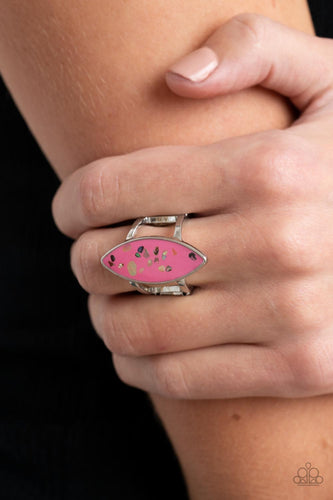 Iridescent shell-like flecks are sprinkled across a pink backdrop inside a glassy marquise shaped frame, resulting in a playful splash of color atop layered silver bands. Features a stretchy band for a flexible fit.  Sold as one individual ring.