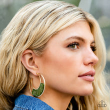 Load image into Gallery viewer, A green acrylic plate featuring flashes of silver and gold accents adorns the center of a gold half moon frame, coalescing into a trendy hoop. Earring attaches to a standard post fitting. Hoop measures approximately 2&quot; in diameter.  Sold as one pair of hoop earrings.

