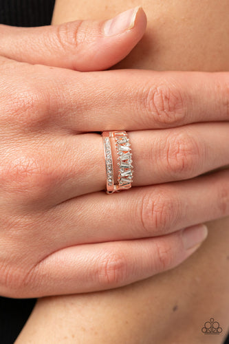 Infused with a timeless band of white rhinestones, a dainty collection of trapezoidal cut white rhinestones staggers across the finger for a glamorously layered look. Features a dainty stretchy band for a flexible fit.  Sold as one individual ring.