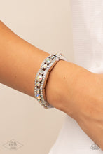 Load image into Gallery viewer, Iridescent rhinestone encrusted silver bars flank a dazzling trio of oversized iridescent rhinestones, coalescing into a glittery frame. The sparkly frames are threaded along stretchy bands around the wrist, creating an irresistible shimmer.  Sold as one individual bracelet.

