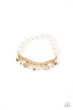 Load image into Gallery viewer, Mismatched gold beads, white pearls, crystal-like accents, gems and heart charms dance from a section of gold chain that attaches to a stretchy band of white pearls around the wrist for a flirtatious sparkle.  Sold as one individual bracelet.
